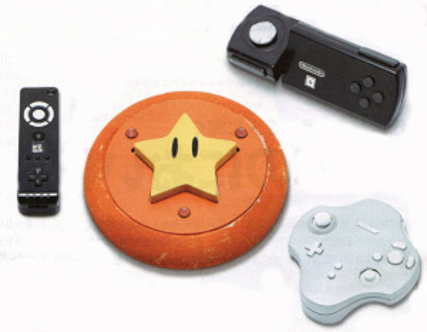 A set of prototype Wii Remotes, including a TV remote-looking thing, a star shaped disc, a fucked up GameCube controller, and something that looks like a cross between an NES controller and that one Ridge Racer PS1 controller.